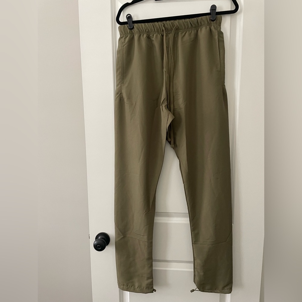 Ladies olive nylon green pants, jogger style. Brand new. Elastic waist.